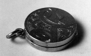This tiny locket holds David Christie's fragment of that Confederate Battle Flag.